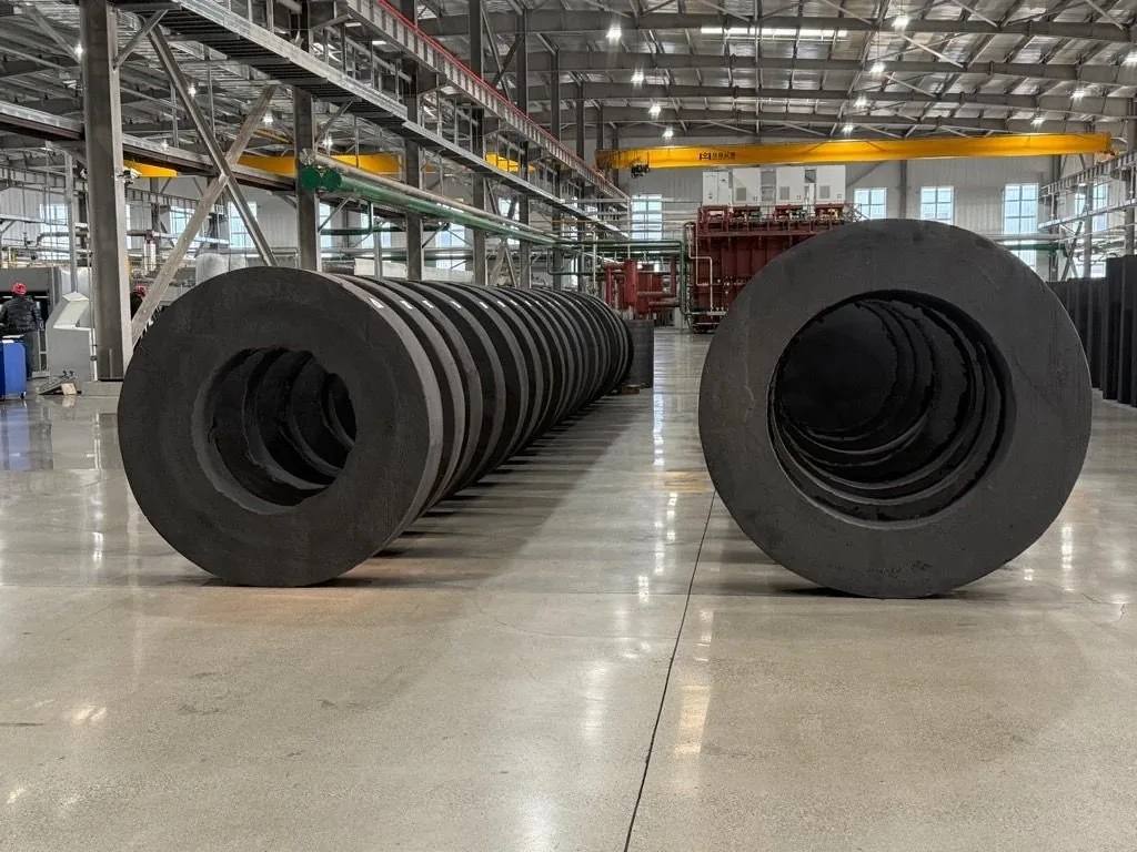 Oversized AYD insulation cylinders staged on factory floor